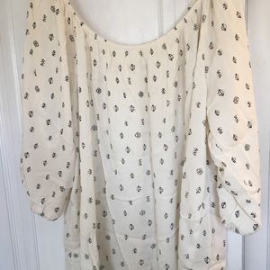 Size 3x (roomy) top. Cream with black design.